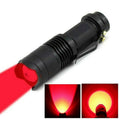 Red LED astronomy flashlight with aluminum body, shown with its deep red beam